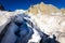 Alpinists crossing glacier crevasse, Aiguilles du Diable peak, Mont Blanc