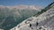 Alpinists hiking on snow mountain. Tourist group climbing a snow mountain peak