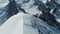 Alpinists on Top of Snow-Capped Mountain in Sunny Day. Aerial View