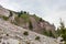 Alpinists walking on path upon Dibona section, an important geologic site of Tofana Mountain Group