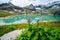 Alps landscape - glacial lake in front of mountains and blue sky