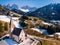 Alps mountain Santa Maddalena village with Dolomites in background, Trentino Alto Adige region, Funes valley, Italy.