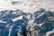 Alps mountains aerial view from airplane snow and avalanches