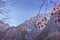 Alps mountains in Berchtesgaden forest with aerial blue sky. Picturesque mountains ladscape with autumn trees. Alpine nature.