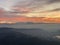 Alps Panorama in winter at sunset with fog in hills in the foreground. The view from Uetliber, Zurich Switzerland