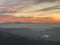 Alps Panorama in winter at sunset with fog, hills and settlements  in the foreground. The view from Uetliber, Zurich Switzerland