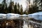 Already slightly thawed, the river sheds its ice shackles after winter in the Taganay national Park