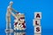 ALS - word on a wooden block on a blue background with pills and a wooden man