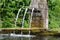 Alsace, a picturesque old fountain in Hunawihr