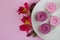 Alstroemeria flowers with plate cakes on white tablecloth background.