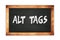 ALT  TAGS text written on wooden frame school blackboard