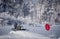 Altai Krai, Russia- February 19, 2020. A man in military uniform rides a snowmobile