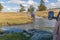 Altai, Mongolia - June 14, 2017:A motorcyclist pushes a motorcycle along a road flooded with water. Altai, Mongolia