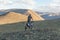 Altai, Mongolia - June 14, 2017: A motorcyclist tries his motorcycle on the hills of Mongolia