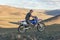 Altai, Mongolia - June 14, 2017: A motorcyclist tries his motorcycle in the mountains of Mongolia