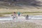 Altai, Mongolia - June 14, 2019: Mongolian children show tourists local attractions