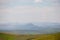 Altai mountain range on the horizon in colors, as in the paintings of Roerich