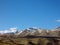 Altai mountains with snow-capped peaks against a bright blue sky