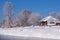 Altai russian country village Talitsa under winter snow on bank of river