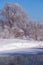 Altai russian country village Talitsa under winter snow on bank of river