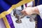 An altar boy or acolyte in a Holy Week procession filling one of the censors with incense. Selective focus photography with focus