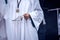 Altar boy with white robe in procession