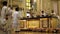 Altar boys in homage in the church during mass celebration