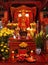Altar with a deity and flowers inside the Temple of Literature. Hanoi