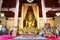 Altar and golden Buddha statue in the main prayer hall at Wat Phra Singh, Chiang Mai, Thailand