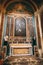 Altar with an icon between the columns and statues of monks in the Church of St. Ignatius in Dubrovnik