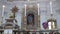 Altar and marble aedicule with Madonna statue in the church.