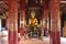 altar and statue of buddha in a temple (wat pak khan khammungkhun) in luang prabang (laos)