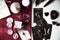 Altar with tarot cards on a burgundy scarf with several white quartz crystals, runes, black candles and selenite.