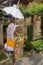 Altar woven from bamboo wicker, covered with white cloth with gold pattern. Offerings to the Gods stored inside a Hindu altar,