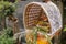 Altar woven from bamboo wicker, covered with white cloth with gold pattern. Offerings to the Gods stored inside a Hindu altar,