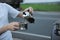 Alternative brewing coffee in a french press on the hood of a car on the side of the road on a journey