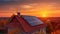 Alternative electricity source. Solar panels, photovoltaics on the red roof of a house and a beautiful sky with the setting sun.