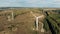 Alternative energy concept. Two windmills, wind towers working on a big field.