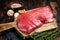 Alternative flank beef steak, raw meat. Wooden background. Top view