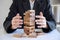 Alternative Risk and Strategy in business, Business woman`s hands protect balance wooden stack with hand control risk shape