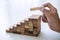 Alternative Risk and Strategy in business to make growth, Image of Business man`s hand placing making a wooden block stacking