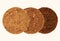Alternative type of processed cocoa. Three piles of cocoa powder of different colors on a beige background. Comparison of dutch