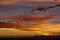 Alto cumulus clouds in vibrant dramatic Spanish sunset.