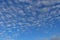 Altocumulus clouds and blue sky background