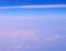 Altocumulus and Stratiform Clouds in Infinite Blue Sky with Shades of Pink - Aerial View - Abstract Natural Background