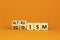 Altruism or egoism symbol. Concept words Egoism and Altruism on wooden cubes. Beautiful orange table orange background. Business