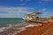 Alum Bay\'s colorful pebbles sand beach in Isle of Wight with the chairlift stop