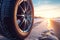 Aluminium alloy or steel auto wheel on the road. Close-up of a car wheel with a rubber tire for winter weather. Generative AI