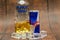 Aluminium can of Red Bull Energy drink with ice and drops, Vodka Absolut. Red Bull is the most popular energy drink in the world.