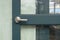 With the aluminium door handle, the green door is opened in the next room.